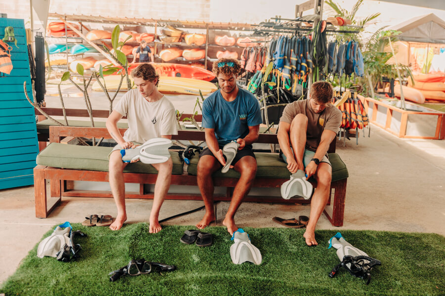 guests try on snorkel gear rentals