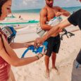 people put snorkel defog in their masks before snorkeling at Lanikai Beach