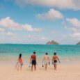 people walk into the waters of Lanikai beach with snorkel gear rentals