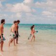 guests walk into Lanikai Beach to snorkel in Kailua