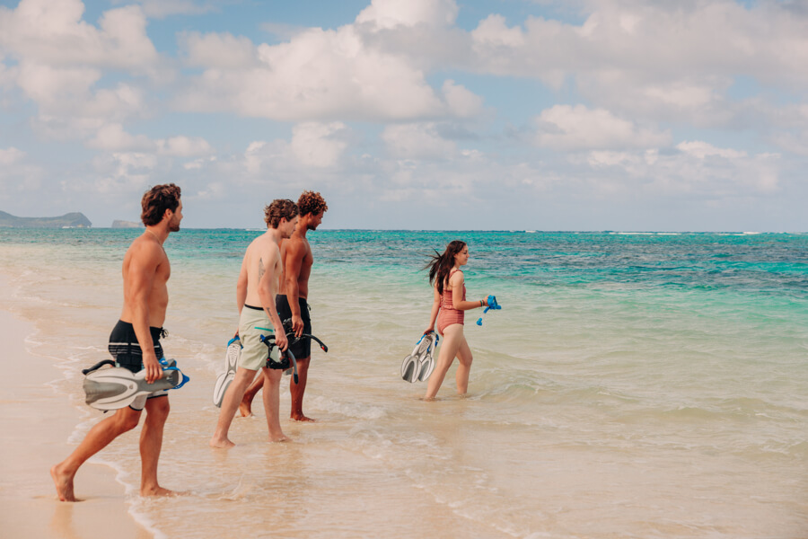 guests walk into Lanikai Beach to snorkel in Kailua