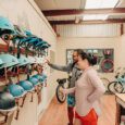 Two guests pick which helmets they want to wear when they e-bike