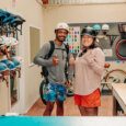 two happy customers are smiling and wearing helmets