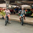 two guests test ride electric bikes in the Active Oahu shop