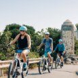 Guests e-bike past Lanikai Monument