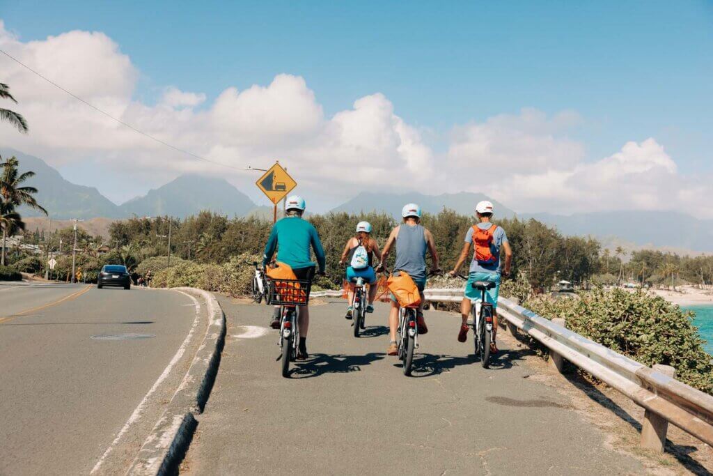 four guests electric biking at a scenic spot in Kailua