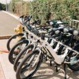 E-bike rentals from Active Oahu locked to a bike rack outside.