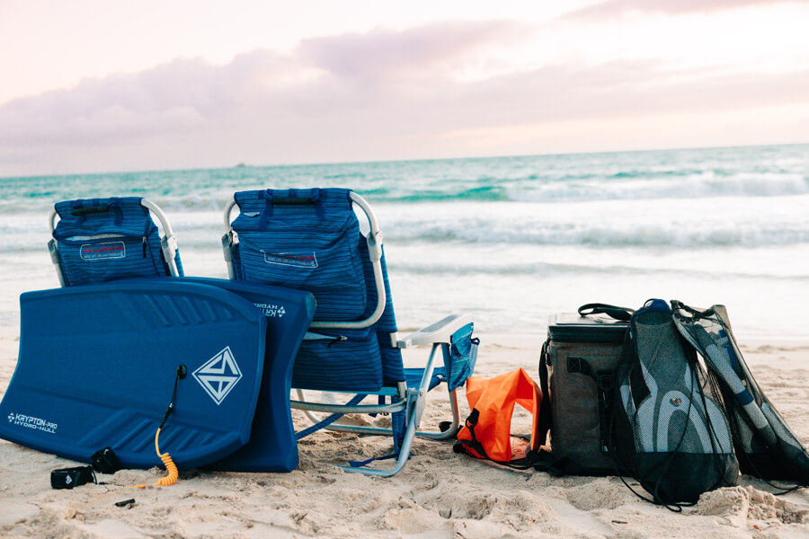Beach chairs, snorkel gear, and other beach gear rented from Active Oahu set up on a beach