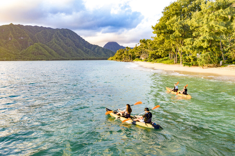 people using two tandem kayak rentals from Active Oahu in Kahana Bay