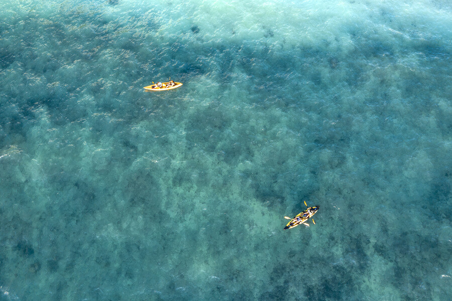 Overhead view of two tandem kayak rentals from Active Oahu in the ocean