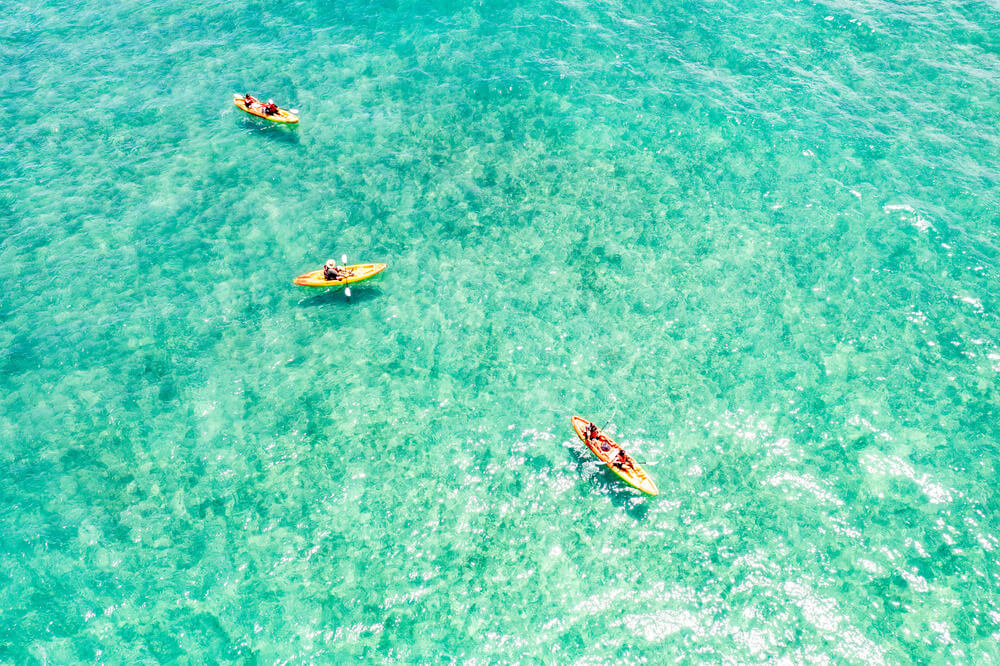 three kayak rentals from Active Oahu in the ocean