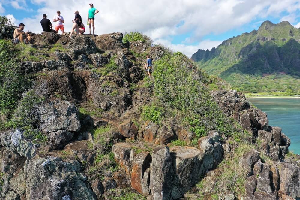 People at the top of Chinaman's hat