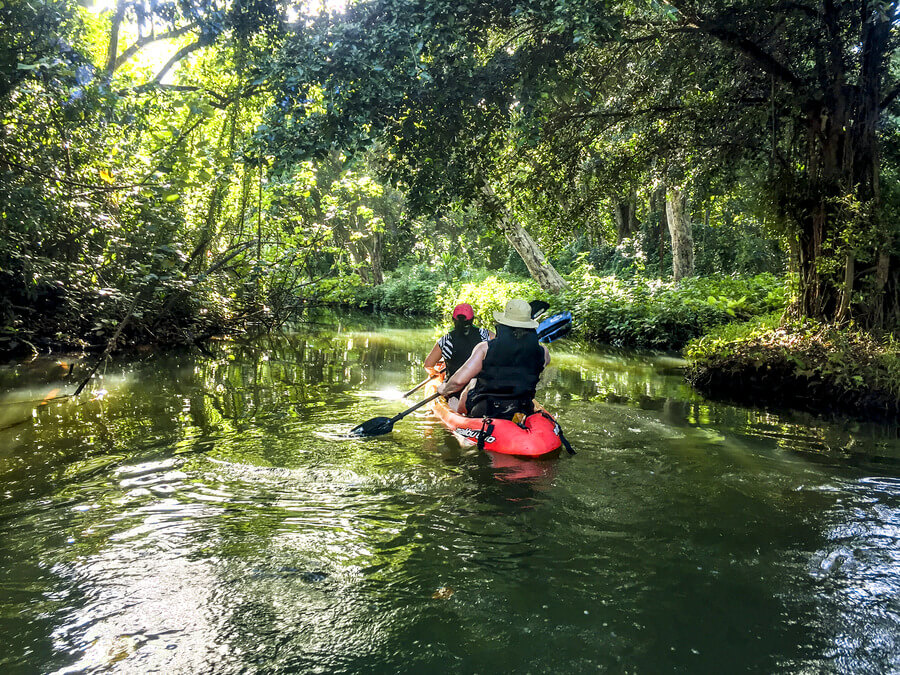 People on a tandem kayak rental from Active Oahu in Kahana River