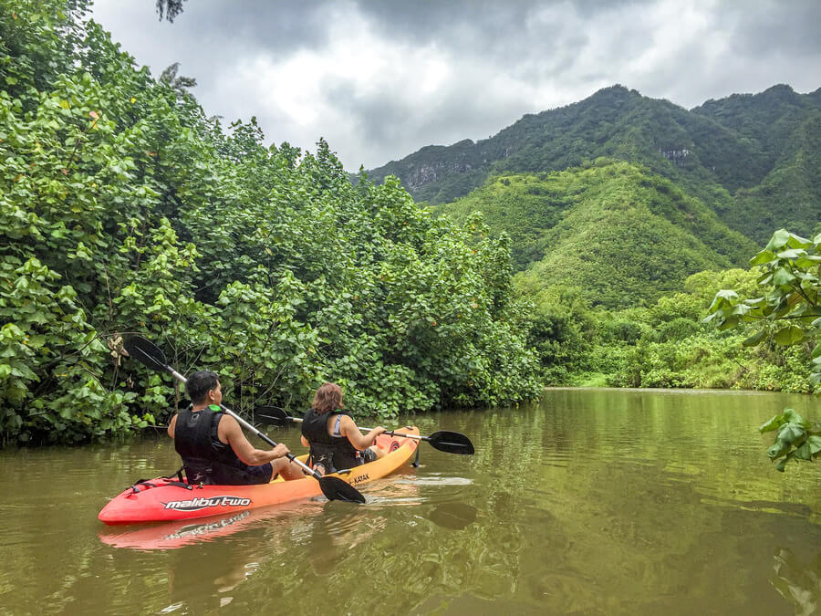 people on a tandem kayak rental from Active Oahu in Kahana River