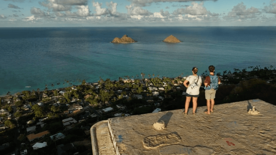 Drone view of two people on top of the Lanikai Pillbox