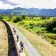 people e-biking on a scenic Marsh trail in Kailua