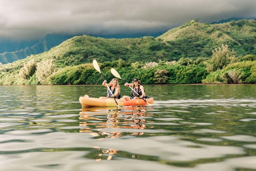 Two people kayak on their tandem kayak rental from Active Oahu