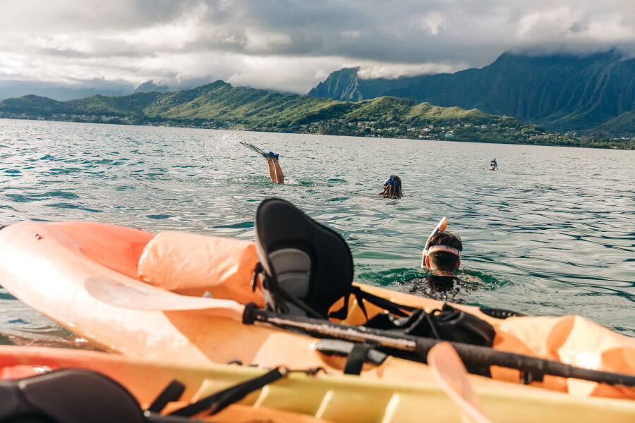 People snorkeling next to their kayak rentals from Active Oahu