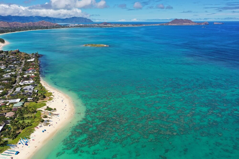 Overhead drone view of Lanikai Beach and the reef where people can snorkel