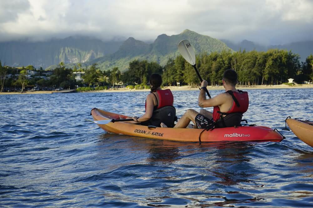 two people in their tandem kayak rental from Active Oahu in the waters of Kailua Beach