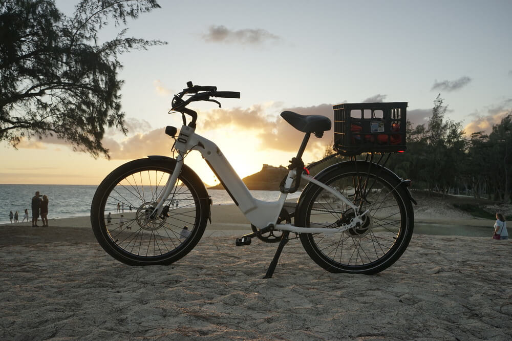 electric bike on the beach at sunset